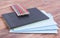 Tablet, notebook and pencils lying on a wooden background