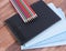 Tablet, notebook and pencils lying on a wooden background