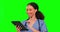 Tablet, nurse smile and woman on green screen in studio isolated on background. Technology, medical professional and