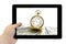 Tablet PC in hand with antique gold watch on a stack of money dollars background