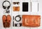 tablet pc, headphones, camera, shoes, watch and sunglasses on th