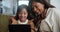Tablet, search and mother and daughter on a sofa with cartoon, streaming or gaming in their home together. Digital, love
