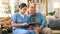 Tablet, senior man and caregiver for insurance, support and planning for healthcare at nursing home. Elderly person