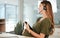 Tablet, smile and a pregnant woman in a call center for customer service or support with a headset. Tech, advice and