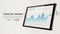 Tablet with stock market candlestick graph advertising