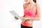 Tablet used by slim beautiful young sportswoman