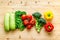 A tabletop arrangement of fresh vegetables multicolored, top view