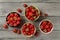 Tabletop view - strawberries in small ceramic bowls, some of the