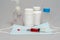 tablets in jars, antiseptic gel, disposable mask, syringe with a red vaccine.