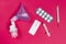 Tablets, syringe, mask inhaler and thermometer on pink background. Medicines for illness. Treatment concept