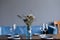 tableware Glasses, flower fork, knife served for dinner in restaurant with cozy interior