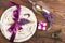 Tableware with violet lupines and silverware