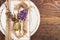 Tableware with violet lupines and silverware