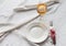 Tableware, white plate, fork, knife, juice on a white tablecloth