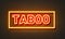 Taboo neon sign on brick wall background.