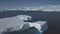 Tabular iceberg float antarctic ocean aerial view