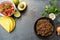 Taco ingredients with roasted beef, tomatoe salsa, avocado and h