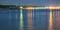 Tacoma bay with boat lights reflections at sunset