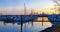 Tacoma port and marina with boats at sunset.