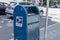 Tacoma, WA USA - circa August 2021: Street view of a United States Postal service blue mailbox in downtown Tacoma