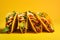 Tacos tasty fast food street food for take away on yellow background