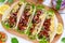 Tacos is a traditional Mexican dish. Tortilla stuffed with chicken, bell and hot peppers, beans, lettuce, cheese