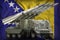 Tactical short range ballistic missile with arctic camouflage on the Bosnia and Herzegovina national flag background. 3d