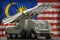 Tactical short range ballistic missile with arctic camouflage on the Malaysia national flag background. 3d Illustration