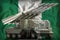 Tactical short range ballistic missile with arctic camouflage on the Nigeria national flag background. 3d Illustration