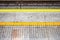tactile paving for visually impared at subway platform edge. yel