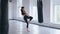 Taekwondo professional athlete woman kicks the punches bag in gym. Athletic Kickboxing woman training in gym.