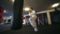 Taekwondo training with punching bag, backlit. Slowly