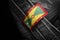 Tag on dark clothing in the form of the flag of the Grenada