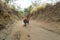 Tagaytay, Philippines - April, 6, 2017: Tourists riding horses on hiking trekking tour trail to Taal volcano, Batangas