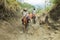 Tagaytay, Philippines - April, 6, 2017: Tourists riding horses on hiking trekking tour trail to Taal volcano, Batangas