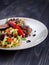 Tagliata of beef with salad on a plate