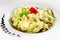 Tagliatelle pasta with pesto on light plate