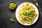 Tagliatelle pasta with pesto sauce and parmesan.