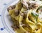 Tagliatelle pasta with sausage and zucchini