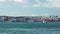 Tagus river with tourist boat and moored warships in Lisbon, Portugal