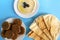 Tahina dipping, pita bread and falafel on blue background. Flat lay, top view. Egypt food