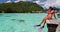 Tahiti snorkel swim woman snorkeling in coral reefs of French Polynesia ocean