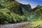 Tahiti.Tropical nature and mountain river against the blue sky