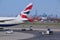 Tail of British Airways plane with New York City in the background