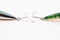 Tail parts of hard fishing lures green colored by perch and gray fish - jerkbaits or crankbaits - with triple sharp hooks horizo