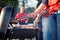 Tailgating: Man Grilling Sausages And Other Food For Tailgate Pa