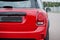 Taillights of red city car. Small car for cities