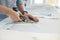 Tailor Hands Cutting Material With Scissors On Table