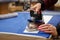 The tailor ironing the white fabric.