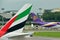Tails of Thai Airways Airbus 340-600 and Emirates Boeing 777-300ER